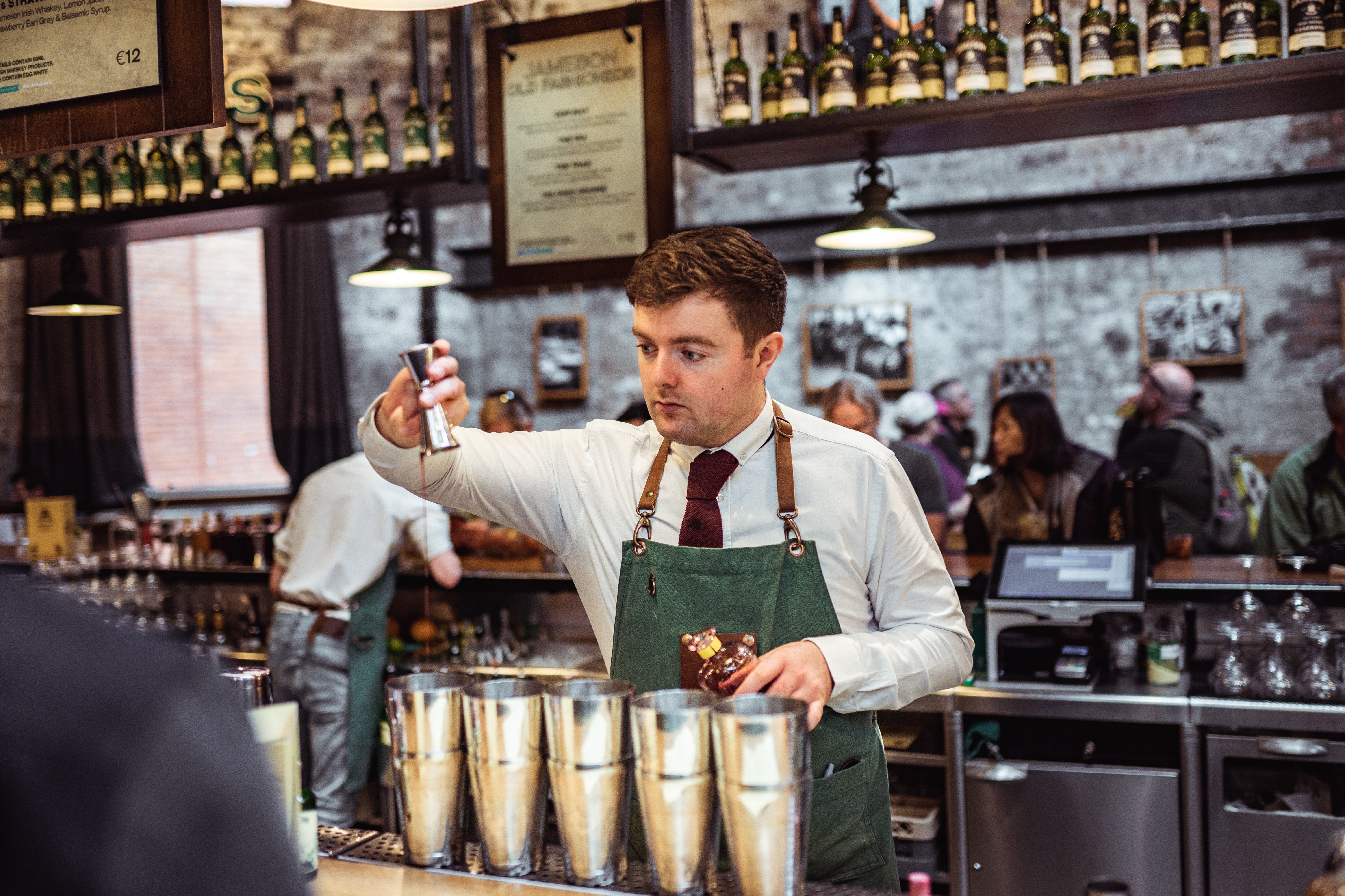 bartender mixing many drinks