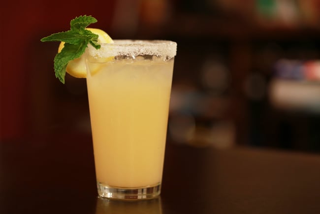 A cocktail with a salt rim glass.