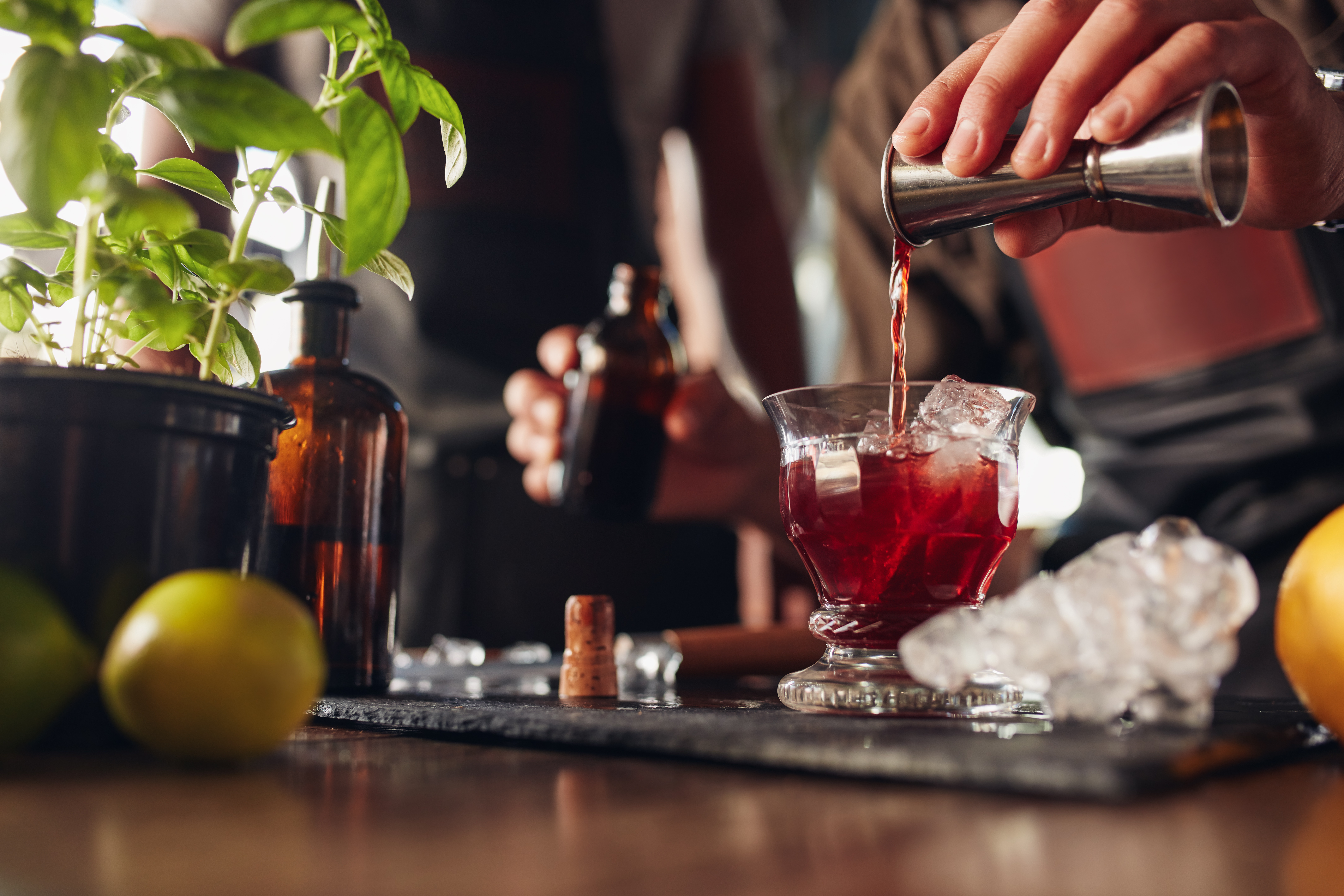 Bartender mixing a non-alcoholic cocktail at a bar