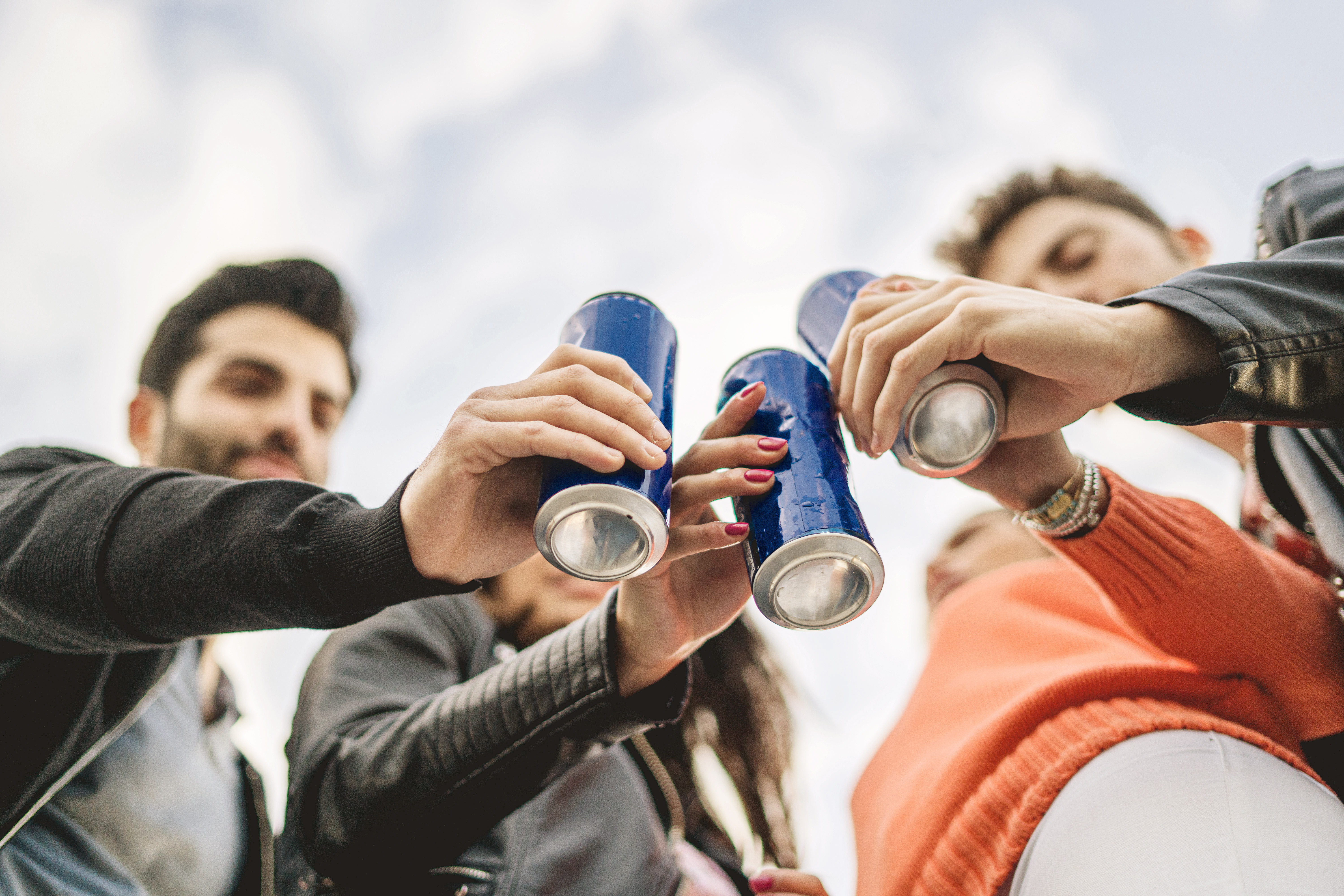 People holding cans