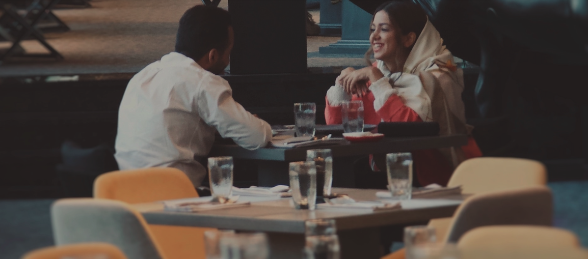 Two patrons eating at restaurant