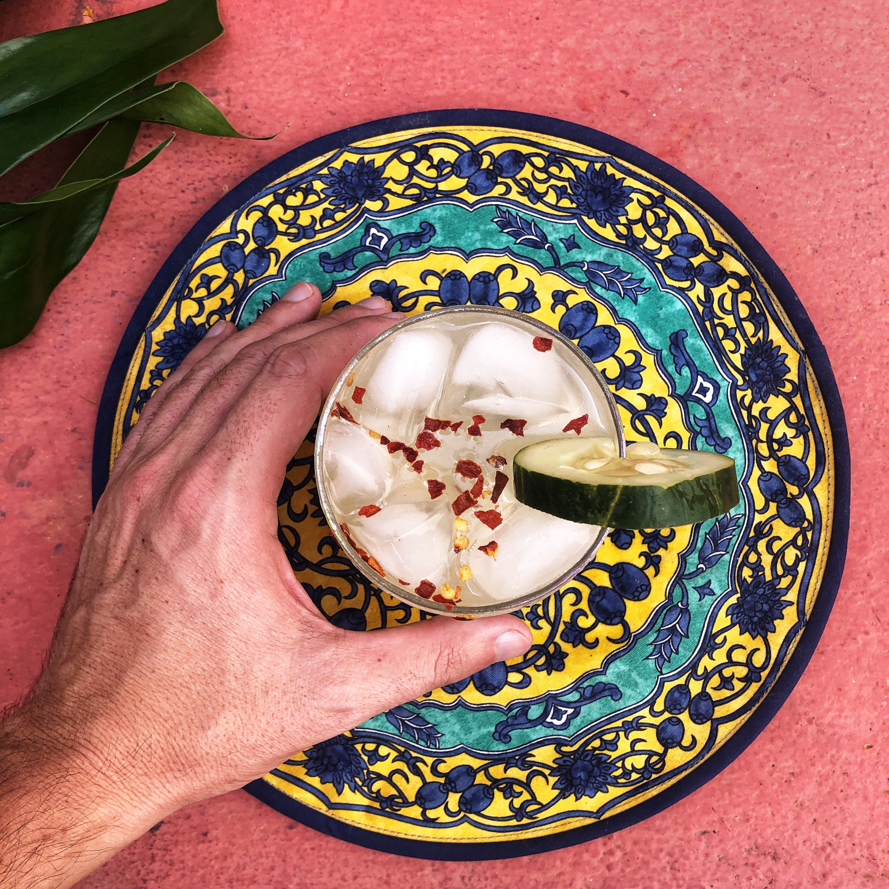 Image of a hand holding a tequila based cocktail 
